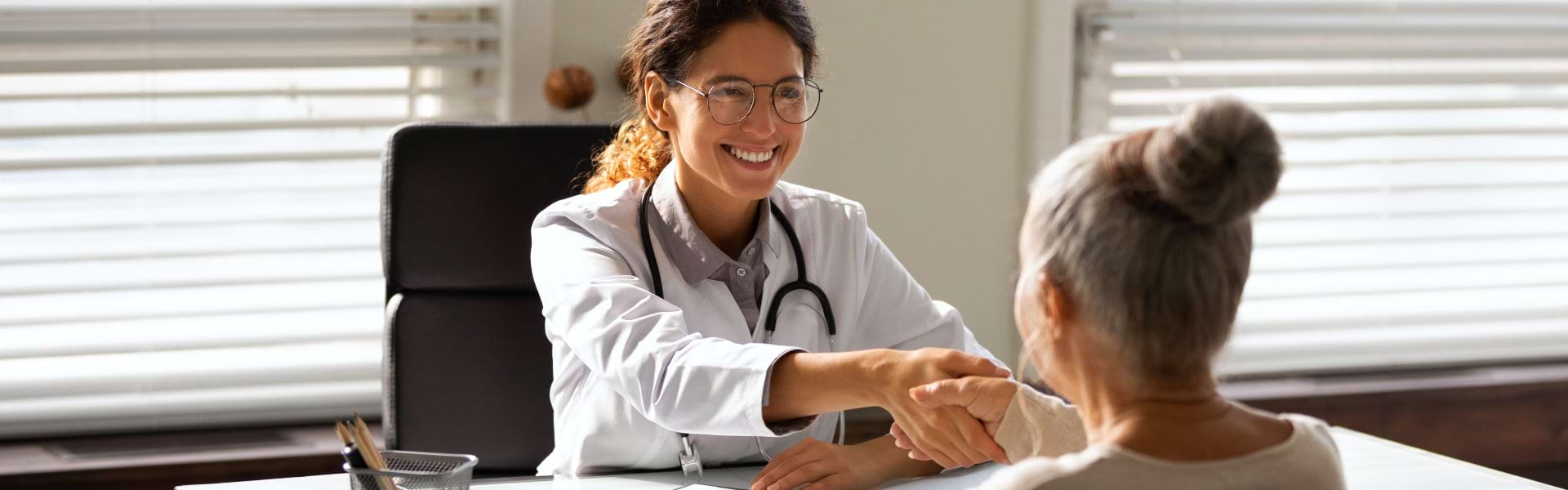 elderly woman consult to female doctor
