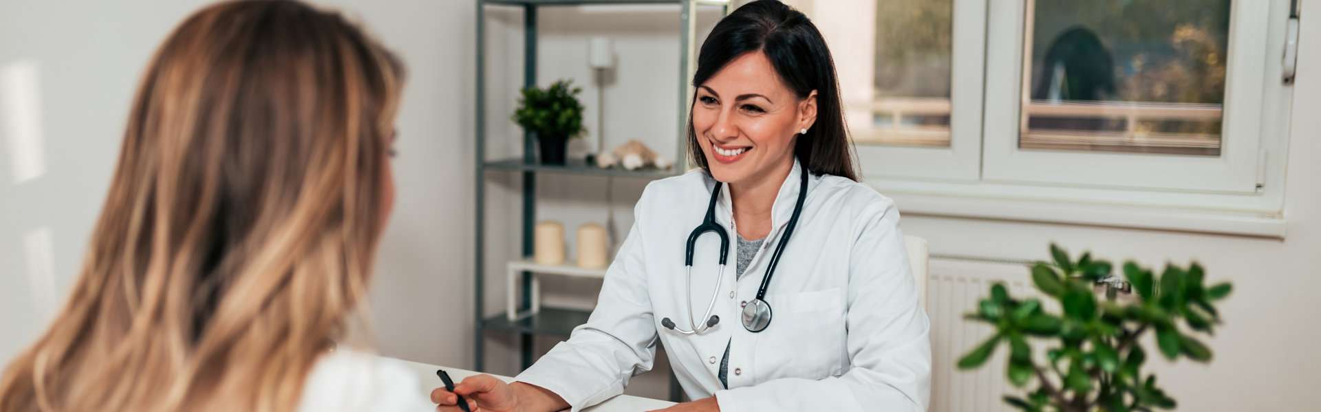 female doctor in conversation with female patient